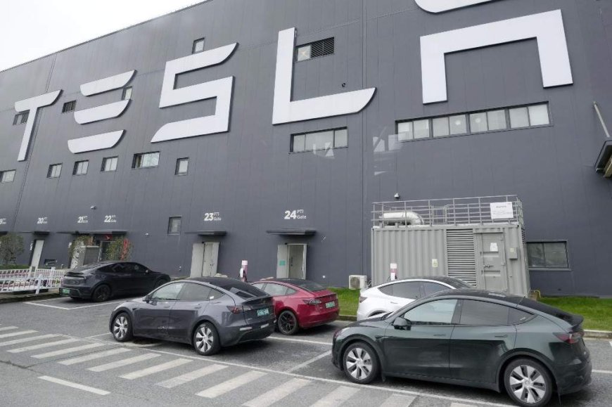 Family of woman killed after Tesla crashes into her home sues company, driver