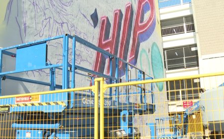 Three-storey Tragically Hip mural being painted in downtown Kingston