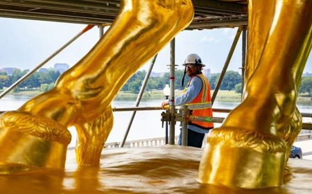 Trump unveils gleaming gold makeover of iconic DC horse statues
