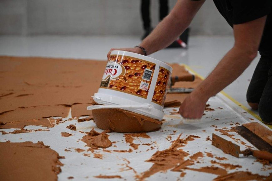 Art museum covers gallery floor in peanut butter to honour late Dutch artist