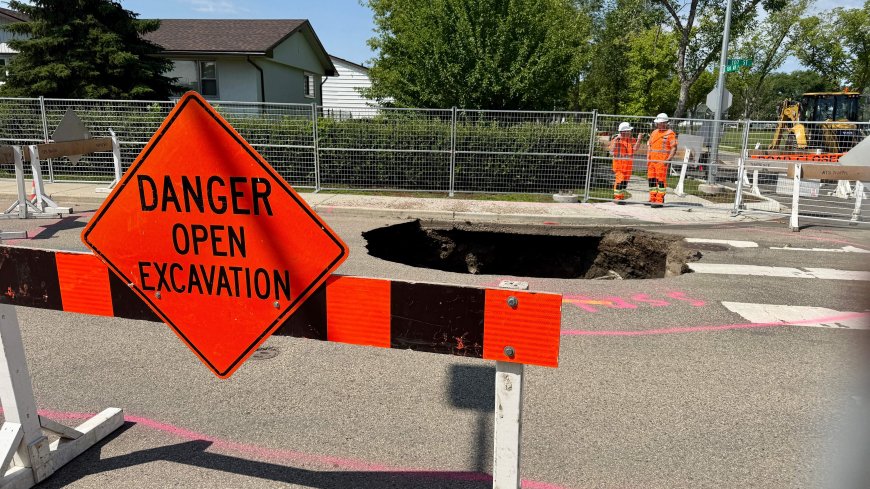 Deep sinkhole opens up in north Edmonton after weekend thunderstorms