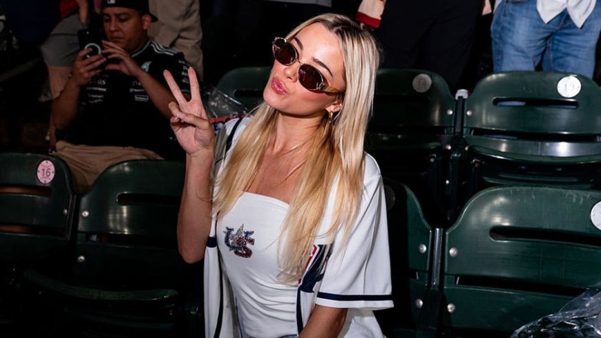Livvy Dunne serves up foamy beers at the Home Run Derby & Hannah Barron goes bikini bowfishing