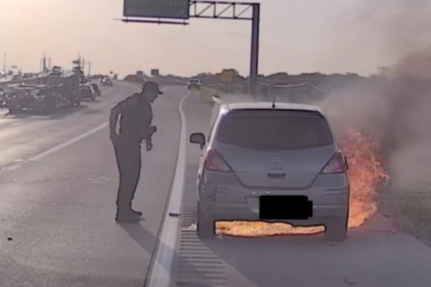 Police rescue of man in burning car on Texas highway caught on dashcam video