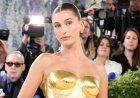 Hailey Bieber shows off toned figure in tiny yellow bikini while sharing summer snaps