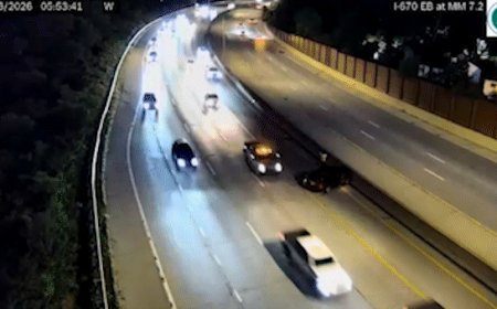 Vehicle narrowly avoids slamming into driver on side of Ohio highway, dramatic video shows