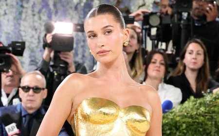Hailey Bieber shows off toned figure in tiny yellow bikini while sharing summer snaps