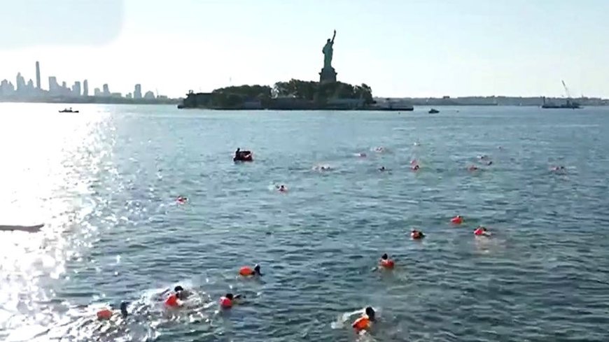 Retired Navy SEALS plunge into New York Harbor for patriotic swim honoring service and sacrifice