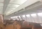 Plane passengers scream in harrowing mid-flight video as violent shaking sends cabin ceiling panels flying