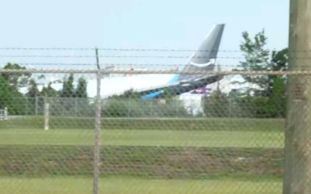 Amazon cargo plane overruns Miami airport runway, striking 'multiple' vehicles and catching fire