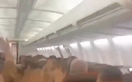Plane passengers scream in harrowing mid-flight video as violent shaking sends cabin ceiling panels flying
