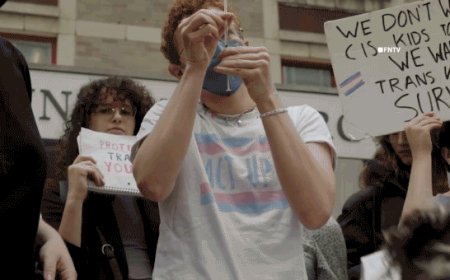 Trans activists inject themselves with hormones in viral stunt protesting Trump's DOJ deal with NYU