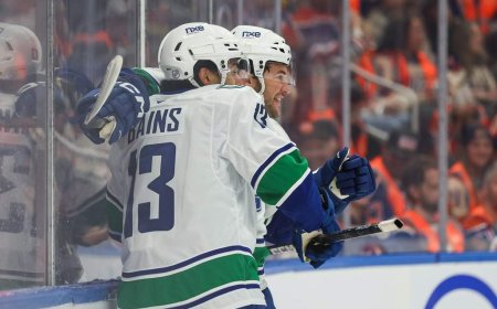 Cotter, Canucks outlast Oilers 6-5 in overtime