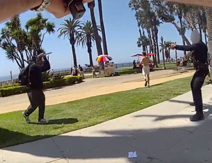 Knife-wielding man races at officer in packed seaside park before one deadly shot rings out: video