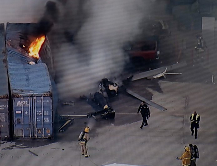 Helicopter crashes and bursts into flames, killing at least 3 people near an LA bus collision