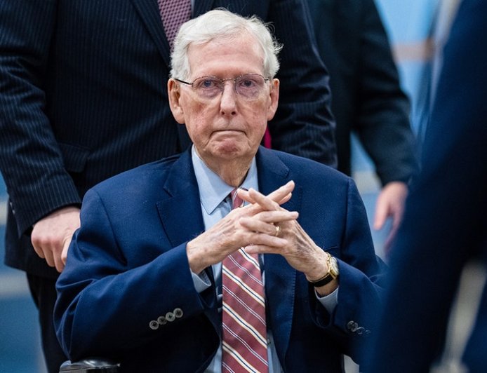 Mitch McConnell swarmed by security as reporter pleads: 'Can you say a word for us?'