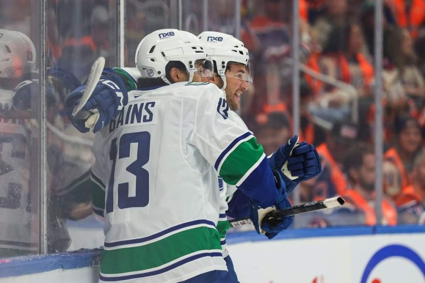 Cotter, Canucks outlast Oilers 6-5 in overtime